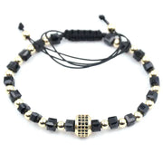 Bratara din onix fatetat pe patrat si inox aurit, model rotund cu zirconii negre